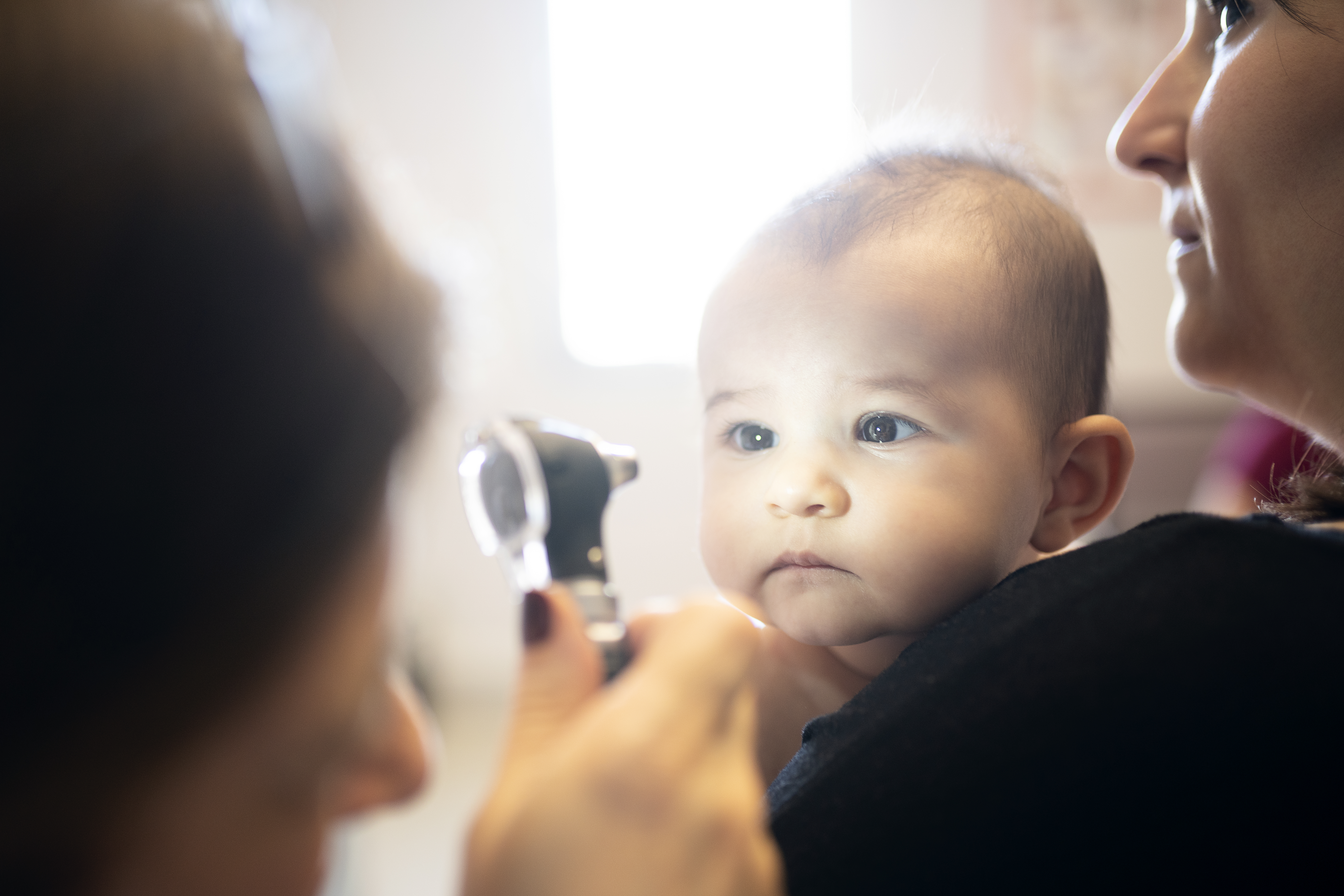 Baby receiving an eye examination.
