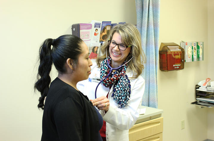 JoAnne Burris helps a patient at the UK Polk-Dalton Clinic.