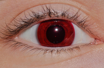 Alexis Johnson wears red contact lenses.