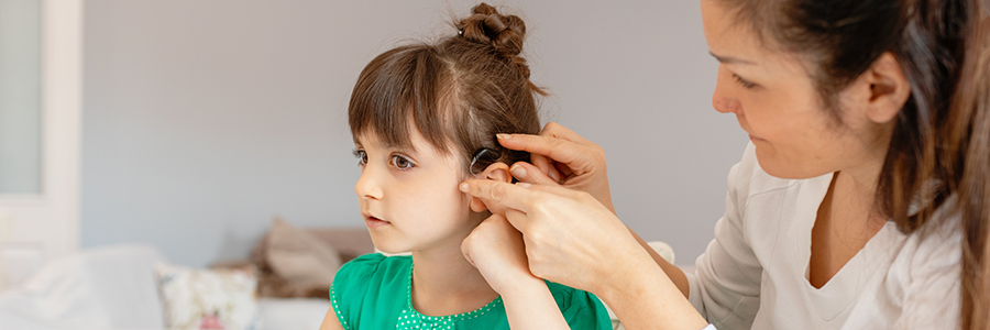 audiology image of girl with hearing aid