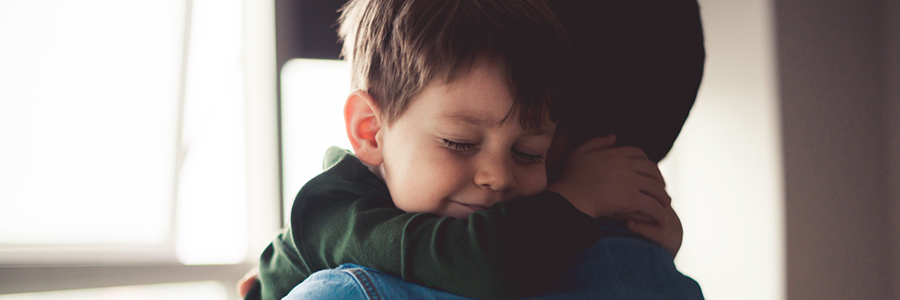 Little boy hugging his dad