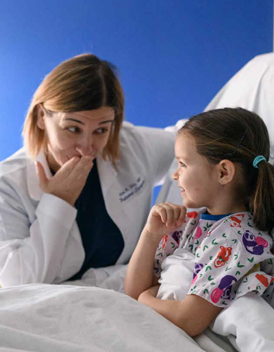 A doctor talks with a patient at Kentucky Children's Hospital.