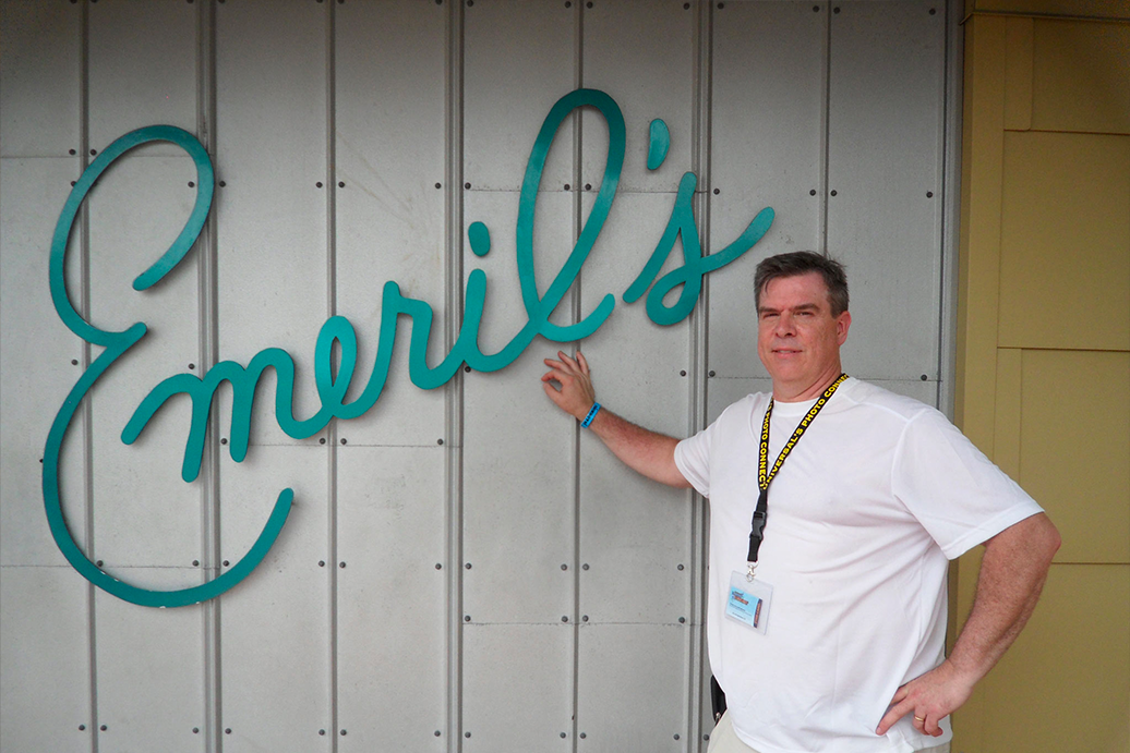 Fred Wohlstein poses for a photo in front of Emeril's Restaurant.
