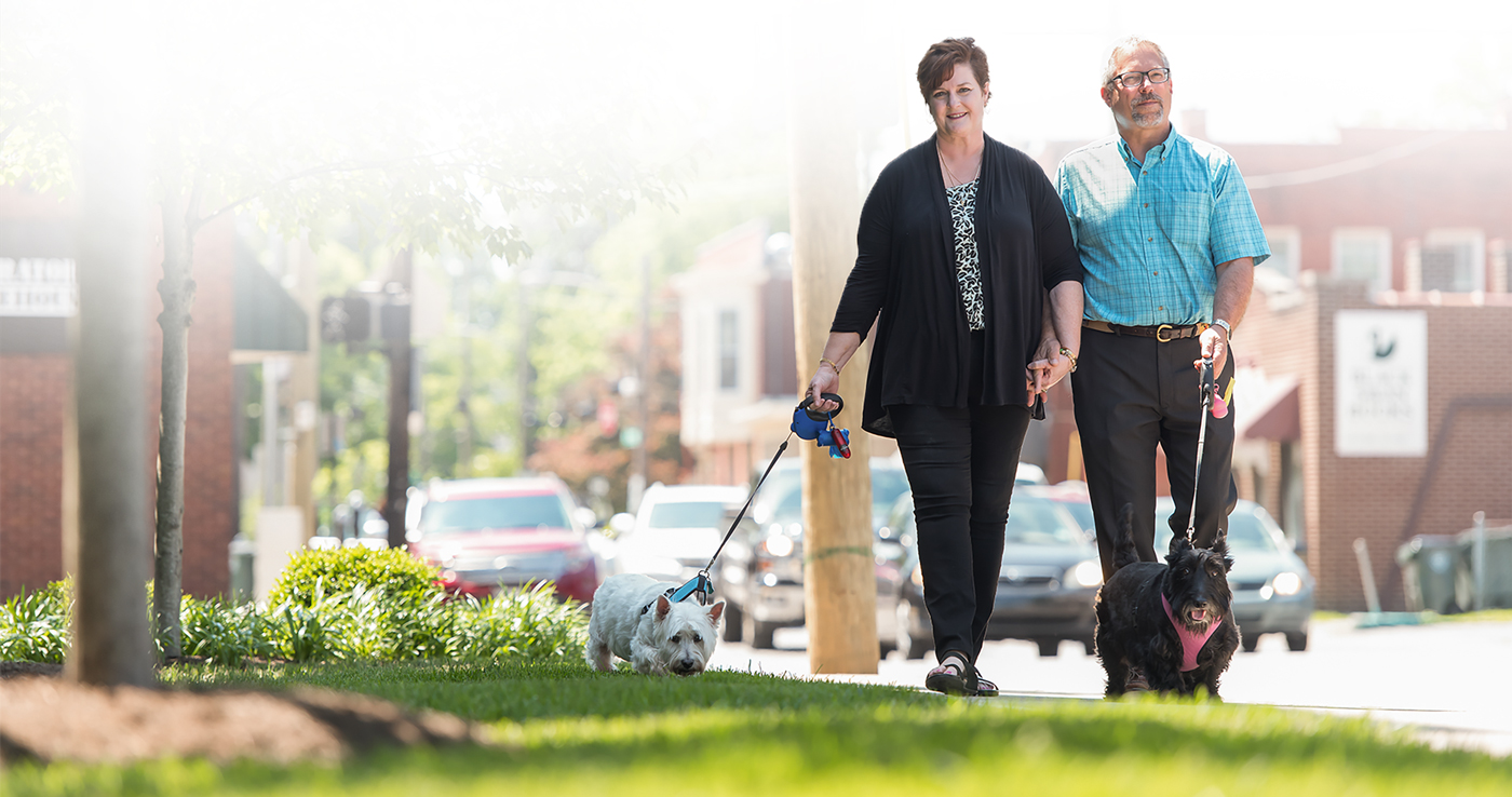 Teresa Schladt and her husband walking their dogs.