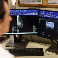 Dr. Marcinkowski reviews a patient's mammogram scans.