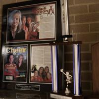News clippings, trophies, and plaques from Donna Martin's time as a cheerleading coach.
