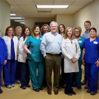 Dr. McLarney and his team pose for a group photo.