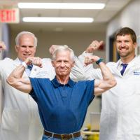 Joe Marksteiner posing with Dr. Michael Cavnar and Dr. Lowell Anthony