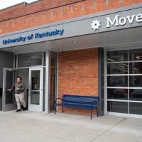 Roger exits the University of Kentucky MoveWell building.