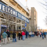 A long line of people outside of the Kroger Field Stadium waiting to get the COVID-19 vaccine.